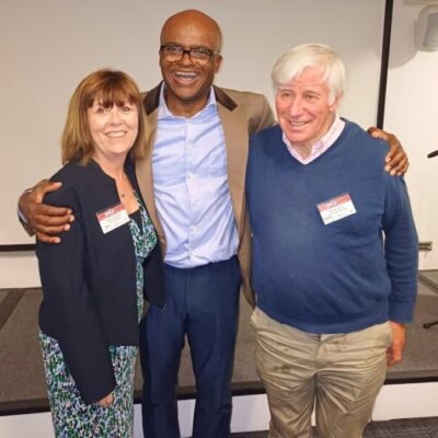 wTrisha Pickersgill, Kriss Akabusi, Mossie Lyons The image shows Trisha Pickersgill, Chief Executive of CRASH Charity, with Olympic medallist and motivational speaker Kriss Akabusi and Mossie Lyons, Director of Kairos Community Trust